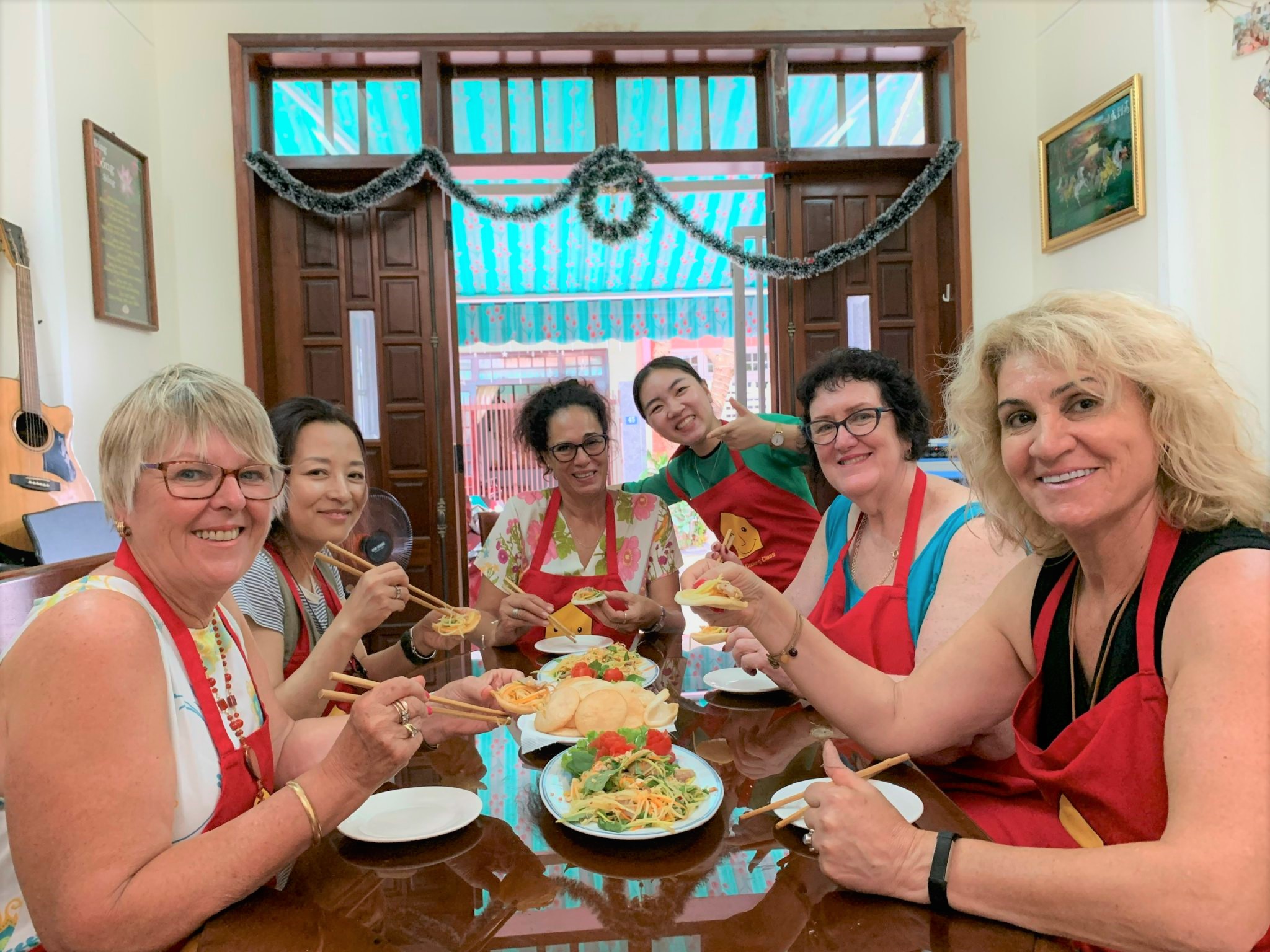 Guests enjoying a hands-on cooking class at Jolie Cooking Class in Da Nang