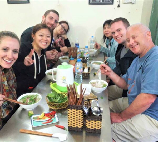 Guests enjoying traditional Vietnamese breakfast at a local eatery in Da Nang.