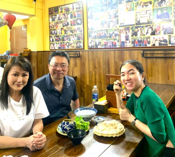 Guests exploring hidden food spots with a local guide in Da Nang