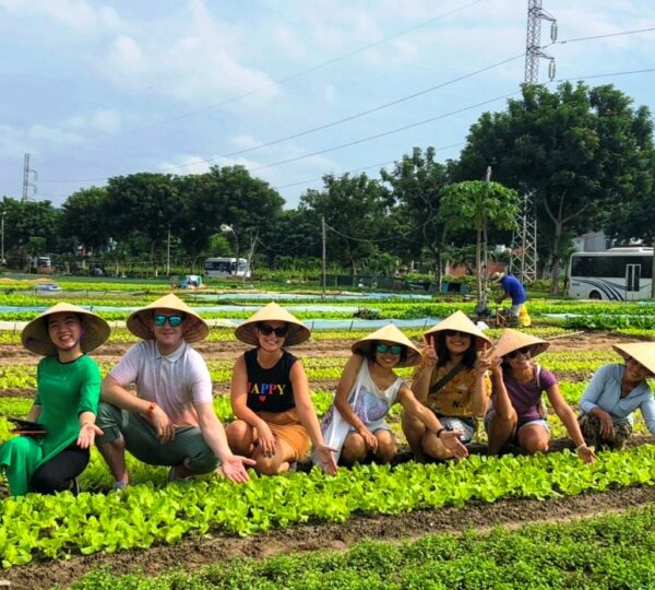 Guests enjoying a fun farming experience at Tra Que Vegetable Village in Hoi An