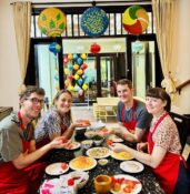 Happy guests showing their dishes at a Da Nang cooking class with Jolie