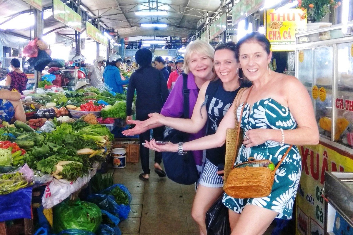 Vegetarian cooking class in Hoi An — fresh herbs and vegetables at a local market